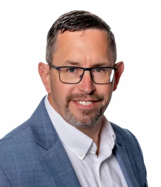 Headshot of James Devine in 2025.