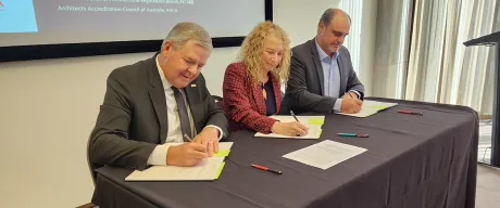 Leadership from NCARB, AACA, and NZRAB sign a new agreement.