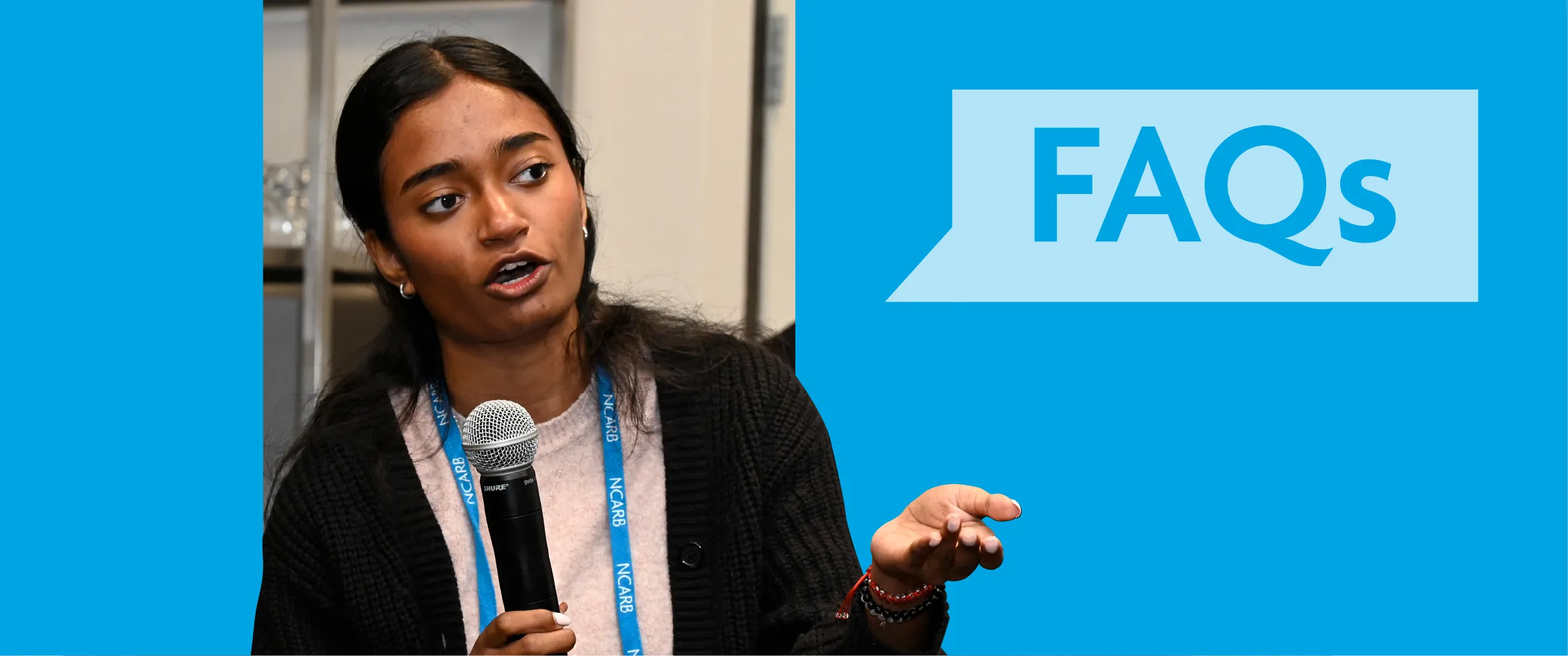 A licensing advisor asks a question into a microphone at an event for architecture licensing advisors.